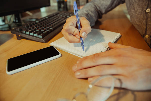istock Man working from home during coronavirus or COVID-19 quarantine, remote office concept 1217128188