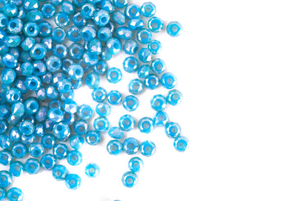 istock close up multi colored beads heap isolated on white 1217128246