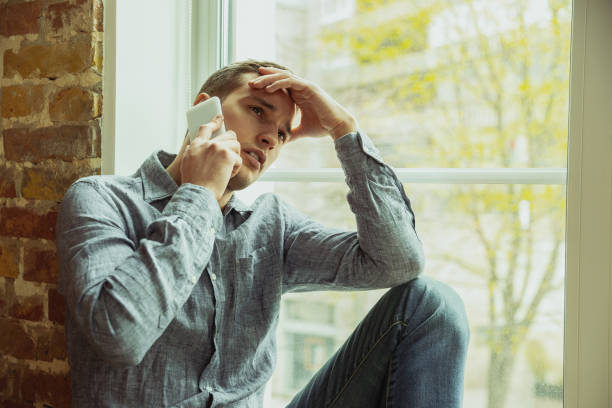 istock Man working from home during coronavirus or COVID-19 quarantine, remote office concept 1217128255