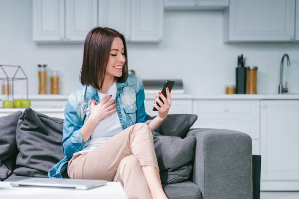 istock Young woman celebrating money win after making bets online at bookmakers website using her laptop 1217132930