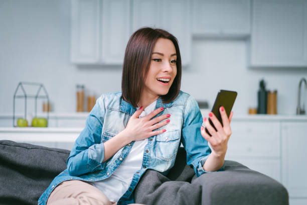 istock Young woman celebrating money win after making bets online at bookmakers website using her laptop 1217132977