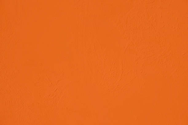 istock Saturated orange low contrast Concrete textured background 1217135215