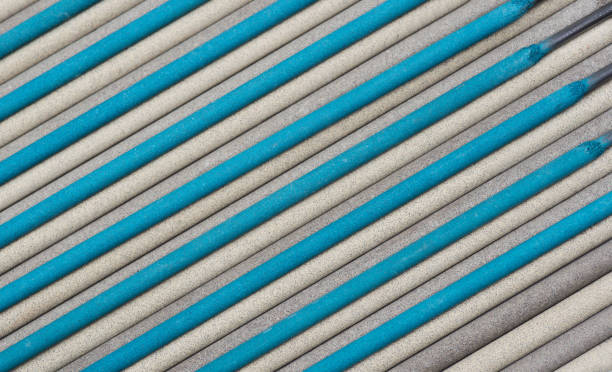 istock Electrodes for welding. Colorful Welding Sticks Electrodes Background 1217135221