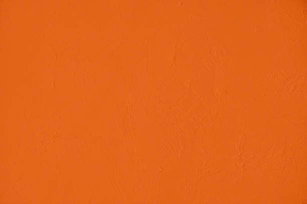 istock Saturated orange low contrast Concrete textured background 1217135300