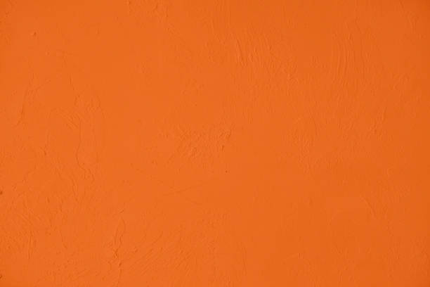 istock Saturated orange low contrast Concrete textured background 1217135424