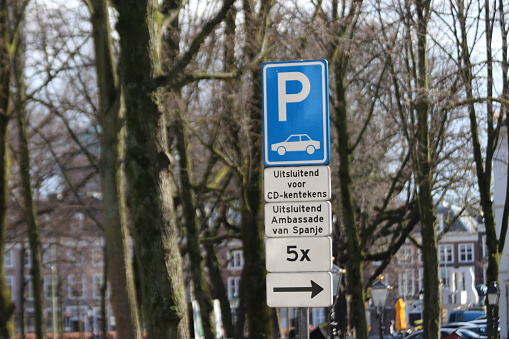 Traffic signs with a prohibition on parking because the parking lot is reserved for staff of the embassy in The Hague, the Netherlands
