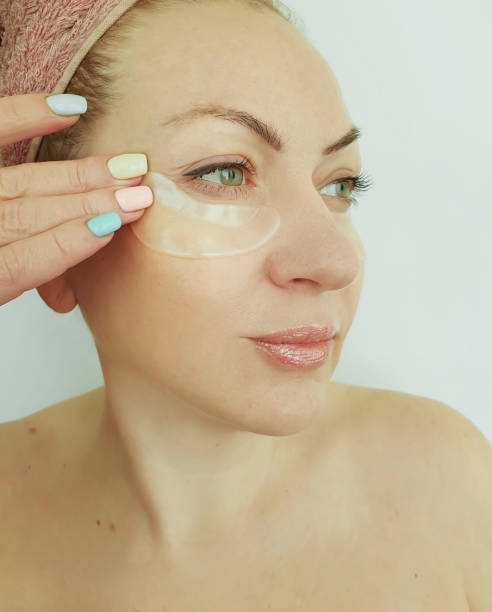 istock woman with cosmetic patches under her eyes 1217136713