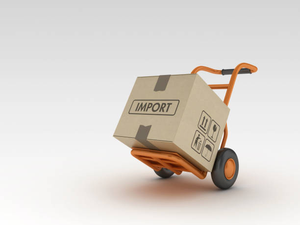 istock Hand Truck and Cardboard Boxes with IMPORT Label - 3D Rendering 1217136903