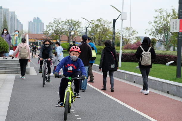 Happy young boy riding his bike.