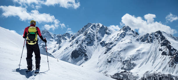 istock Man ski touring at mountains background 1217146863