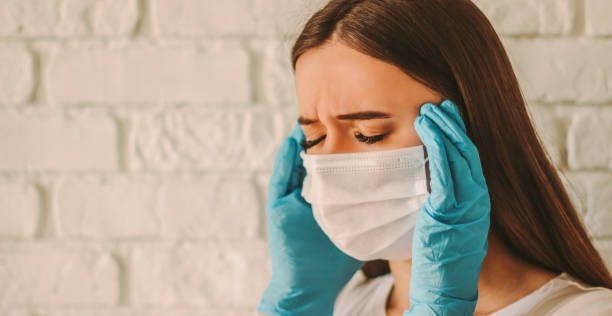 istock Stressed tired doctor having headache 1217149160