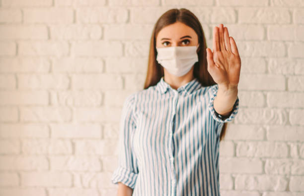 istock Young woman gesturing stop sign with her hand 1217149345
