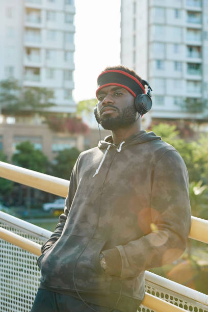 istock Pensive jogger listening to music 1217150131