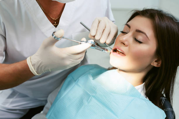 istock Painkiller anesthesia injection. Dentist examining a patient's teeth in modern dentistry office. Closeup cropped picture with copyspace. Doctor in disposable medical facial mask. 1217150178