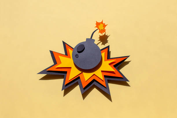 Handmade colorful paper cutting bomb. Pop art and comic style. On yellow background.