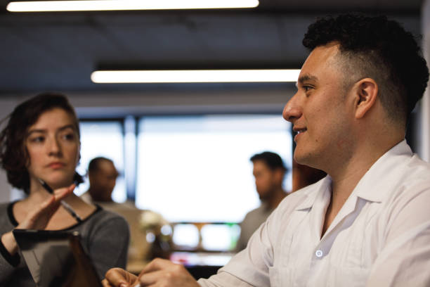 istock Young entrepreneur expressing ideas during a brainstorming session 1217153322