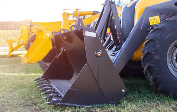 istock New construction equipment, wheel loaders with bucket for loading sand trucks, transportation 1217154017