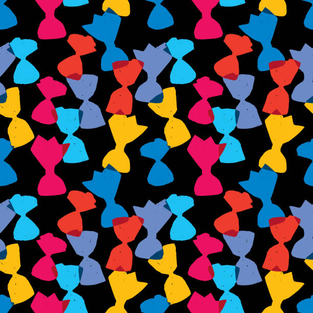 istock Seamless abstract background of silhouettes candies in colorful wrappers 1217154029