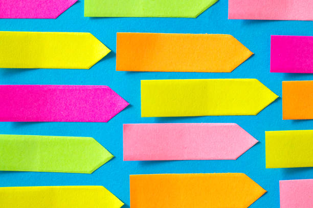 istock Colorful Empty Arrow-shaped sticky papers are on blue paper 1217154834