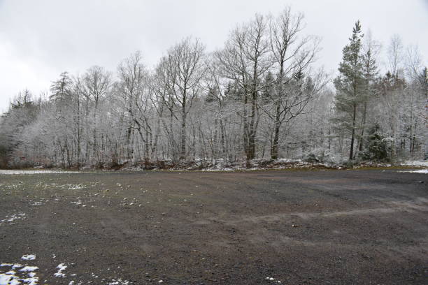 istock gravel parking lot in winter 1217155706
