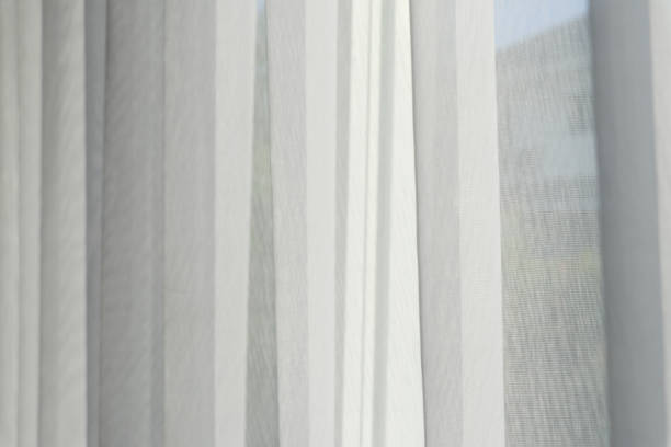 istock White airy curtains in living room background. 1217155737