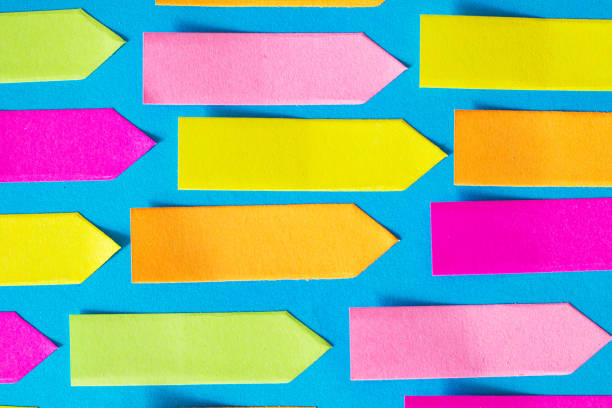 istock Colorful Empty Arrow-shaped sticky papers are on blue paper 1217157556