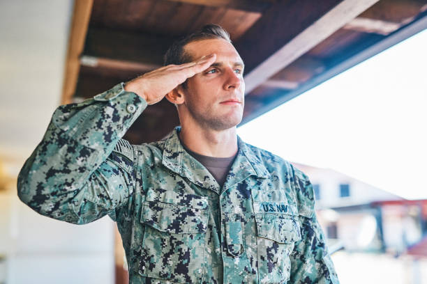 i'll keep my country proud - navy officer armed forces saluting imagens e fotografias de stock