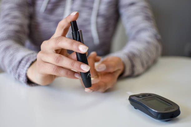 istock Diabetes doing blood glucose measurement 1217160632