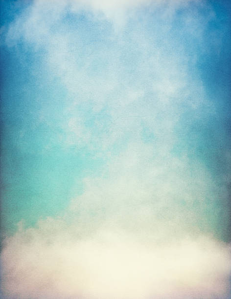 Fog and clouds on a vintage, textured paper background with a color gradient.