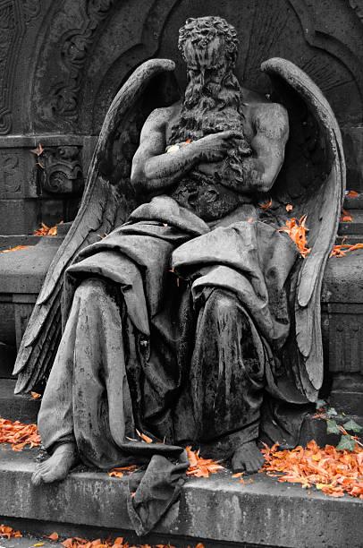 istock male Angel statue on cemetery 121716379