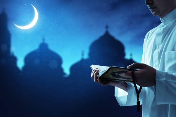 istock Religious muslim man reading holy quran 1217165000