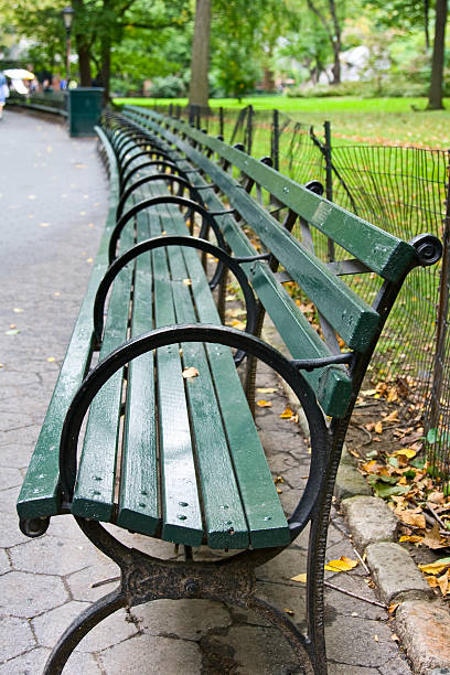 istock Green bench in a city park 121716503
