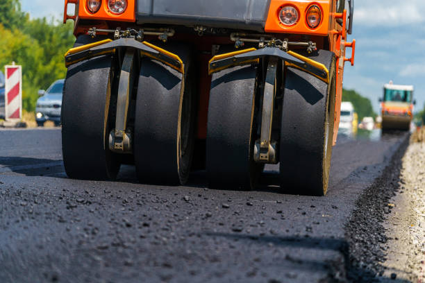 istock Road repair, compactor lays asphalt. 1217165040