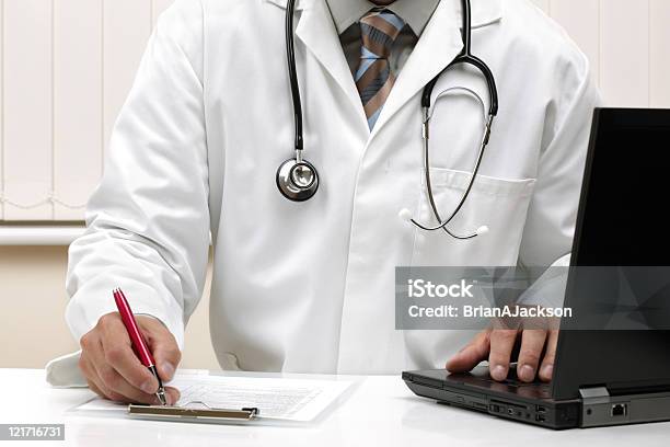 Writing A Prescription Or Medical Examination Notes Stock Photo - Download Image Now