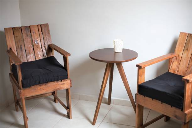 istock Chairs and table made from recycled pallet table and black cushion 1217168142