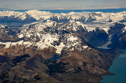 aerial view of Cerro Moyano and Cerro Norte with the southern patagonian ice field and Cerro Agassiz, or Cerro Roma or Cerro Bertrand in the back. Patagonia, Argentina.