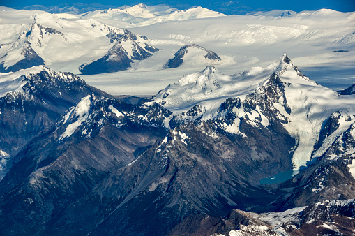 This nameless peak at Los Glaciares national park, patagonia, Argentina, is pretty close to famous mount Cerro Torre and Fitz Roy, but access is very difficult. In the back the huge Southern Patagonian Ice Field. Aerial view