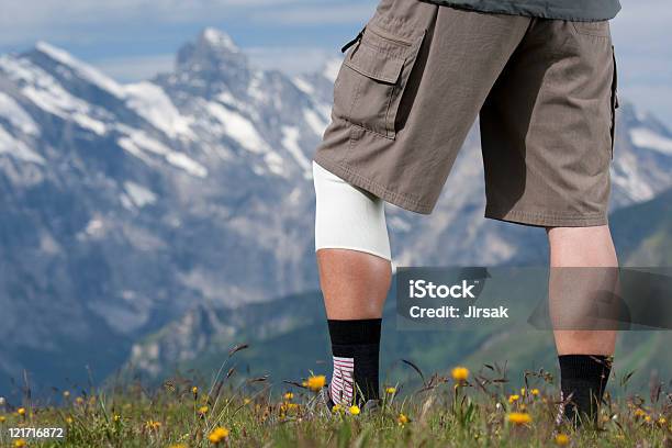 Hiker With Bandage Stock Photo - Download Image Now - European Alps, Hiking, Bermuda Shorts