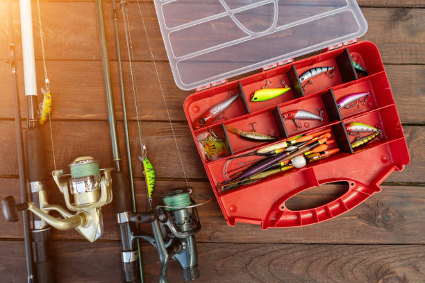 istock fishing rods and tackle on a wooden background 1217169769