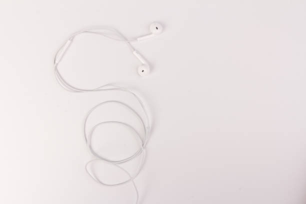 istock White headphones with headset on white isolated background 1217170674
