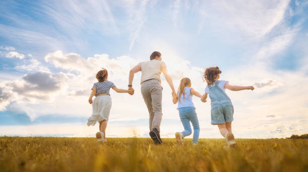 istock Happy family on autumn walk 1217171378