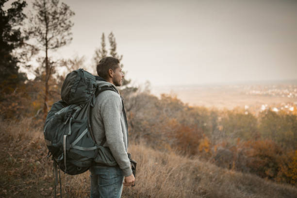 istock Young Backpacker Hiking In Autumn Nature 1217172109