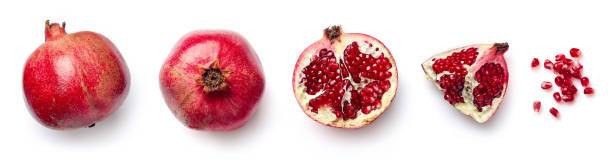 Fresh pomegranate isolated on white background Fresh whole and half of pomegranate isolated on white background from top view saint vincent and the grenadines stock pictures, royalty-free photos & images