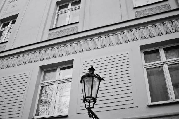 Vintage black street lantern hanging on the wall (Prague, Czech Republic, Europe)