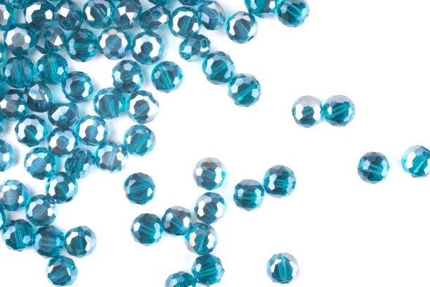 istock close up multi colored beads heap isolated on white 1217174274