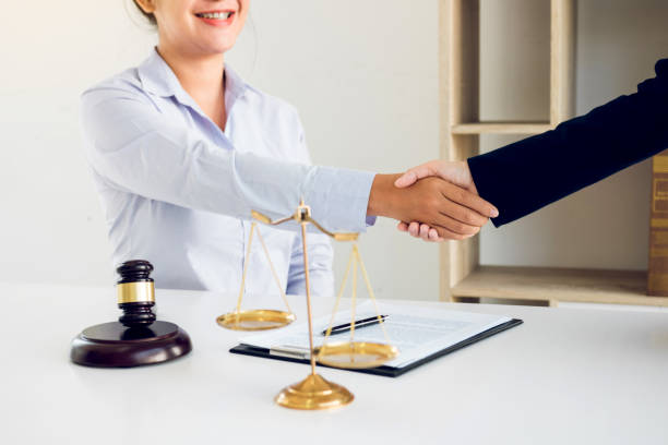 istock Lawyer is currently shaking hands with the client about the success in resolving the case. 1217175266