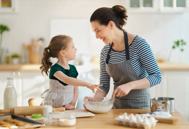 istock family are preparing bakery together 1217175450