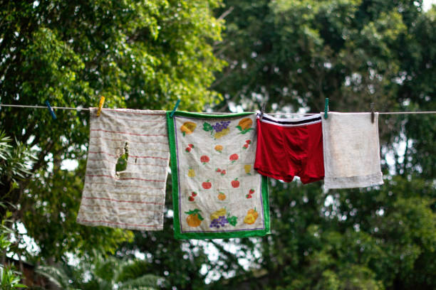 istock Torn clothes hanging on the rope 1217175978