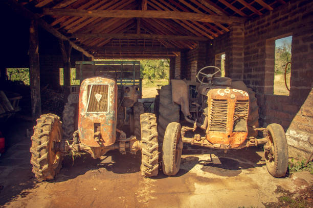 istock Tractors and deactivated machinery in an old sugar cane distillery. 1217176964