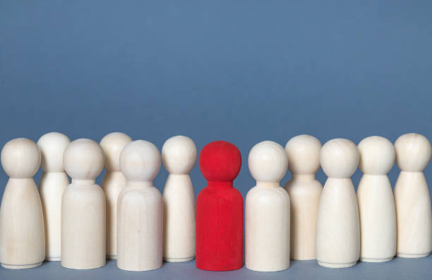istock A diverse or Coronavirus infected person standing out from a crowd with copy space 1217177543